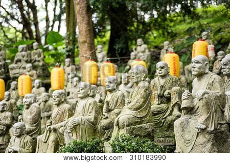 groups of buddhist arhat stone statue in the garden