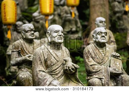 groups of buddhist arhat stone statue in the garden