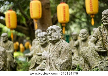 groups of buddhist arhat stone statue in the garden
