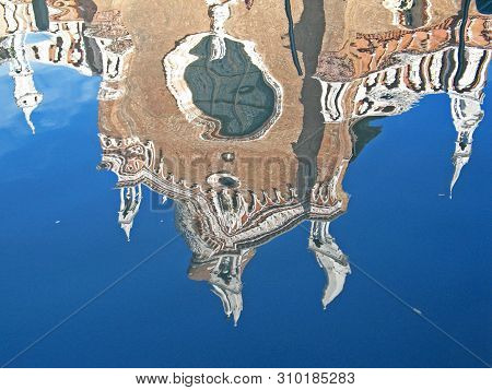 Gothic Church Reflecting In Canal Water In Venice