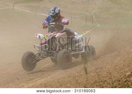 Brezova Nad Svitavou, Czech Republic - June 15, 2019: Young Rider On A Quad Bike In Dust Clouds In I