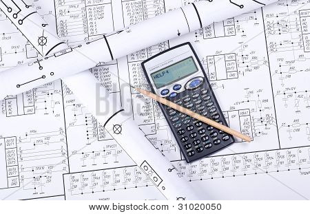 Drawings rolled in a tube, calculator, pencil