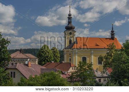 Old Color Church With Red Roof In Pecka Town In Hot Summer Sunny Nice Day