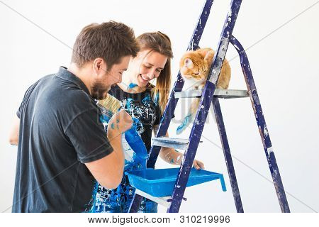Repair, Color, People Concept - Couple With Cat Going To Paint The Wall, They Are Preparing The Colo