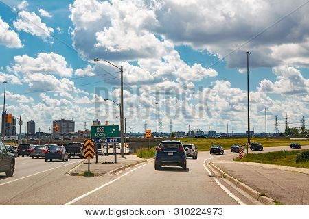 Beautiful Landscape Midday View Of Toronto City Highway Street With Cars Traffic During Sunny Day Wi