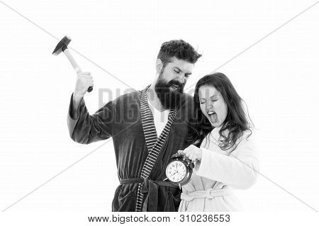 Too Much Noise. Couple Oversleep Awakening Hold Alarm Clock. Lack Of Sleep. Too Early Awakening. Ove