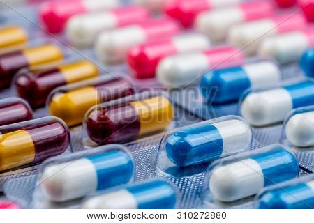 Selective Focus On Blue-white Capsule Pills In Blister Pack. Pharmaceutical Industry. Drug Package. 