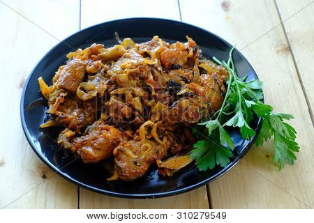 Traditional Polish bigos on the wooden table 