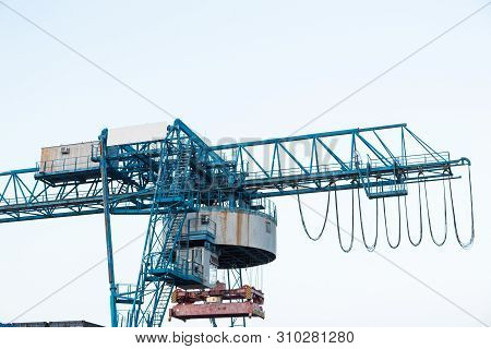 Large Industrial Port Crane Unloads Cargo Containers
