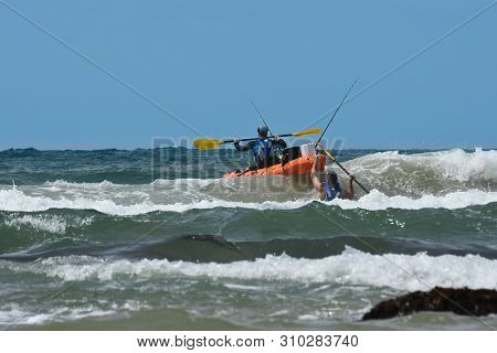 Fishermen With Ocean Kayak In The Waves, Mossel Bay, South Africa