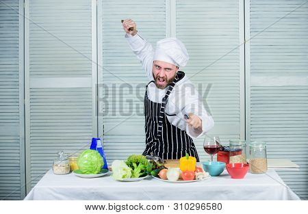 Chef Hold Cleaver Knife Tool Ready To Chop Ingredients. Man Wear Apron Cooking In Kitchen. Man Use S