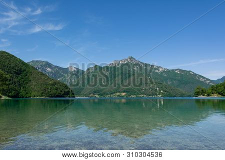 Beautiful View Of Mountain Reflections In The Water Of Lago Di Ledro, Italy