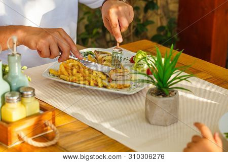 Traditional Montenegrin Meat Negush Steak On A White Plate In A Restaurant.