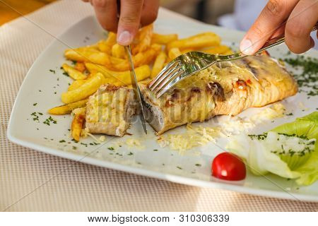 Traditional Montenegrin Meat Negush Steak On A White Plate In A Restaurant.