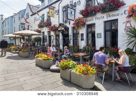 Caernarfon, Wales - August 18th 2015: People Eating And Drinking Ar The Black Boy Inn, Palace Street