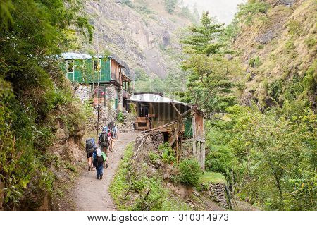 A Group Of Trekkers Heading To Lho Village On Manaslu Circuit With View Of Mount Manaslu Range (8 15