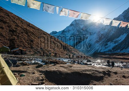 A Group Of Trekkers In Dharamsala Before Walking The Pass On Manaslu Circuit With View Of Mount Mana
