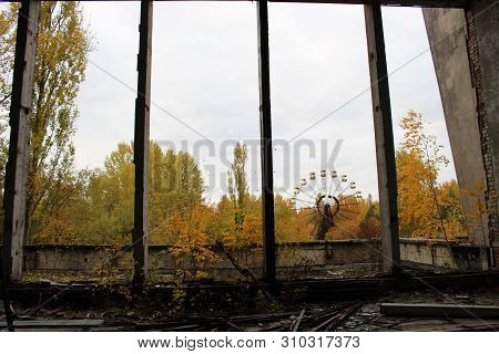 Old Ferris Wheel In The Ghost Town Of Pripyat. Consequences Of The Accident At The Chernobil Nuclear