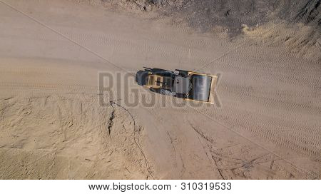 Top Down View Of The Rink Is Rolling Sand During The Construction Of The Road.