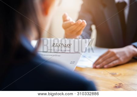 Interviewer Reading A Resume, Person Submits Job Application, Person Describe Yourself To Interviewe