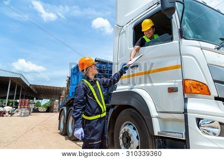 Garbage Engineer, Recycling, Wearing A Safety Suit Standing To Check The Recycling Of Scrap Metal Wi