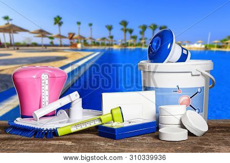 Equipment With Chemical Cleaning Products And Tools For The Maintenance Of The Swimming Pool.