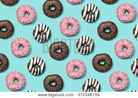 Decorative Donuts Seamless Patterm On Blue Background