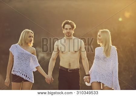 Blonde And Guy With Athletic Chest. Man With Muscular Body With Twins. Love And Romance. Girl And Wo