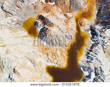 Clay Open Quarry Mars Landscape With Orange Water. Abandoned Rock Texture Old Porcelain Pit Mine In 