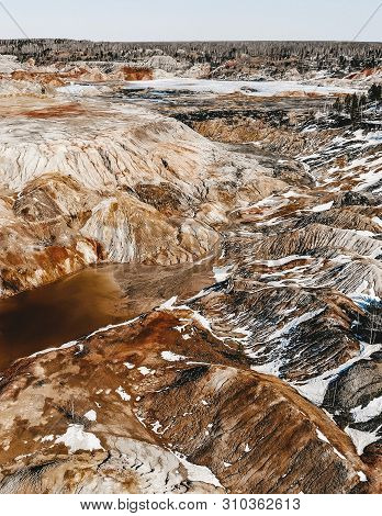 Clay Open Quarry Mars Landscape With Orange Water. Abandoned Rock Texture Old Porcelain Pit Mine In 