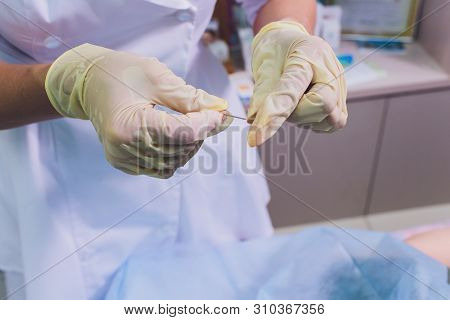 Aged Woman Doing Mesothreads And Thread Lifting, Cosmetology. Cosmetic Procedure To Eliminate Signs 