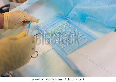 Aged Woman Doing Mesothreads And Thread Lifting, Cosmetology. Cosmetic Procedure To Eliminate Signs 