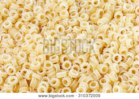 Close-up Shot Of Ditalini Italian Pasta. Pasta Background Pattern . Italian Food.