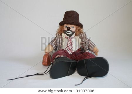 Clown with big boots.