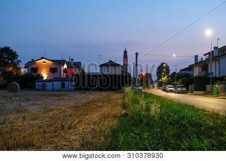 Rovigo, Italy - July, 2, 2019: landscape with the image of Rovigo at sunset