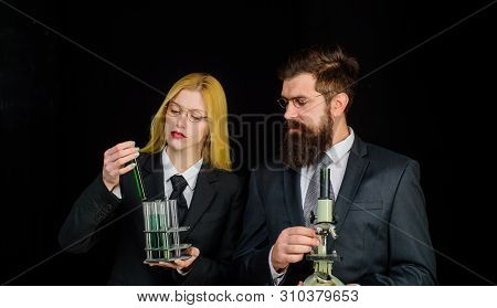 Science, Chemistry, Biology, Technology And People Concept. Scientists With Test Tube And Microscope