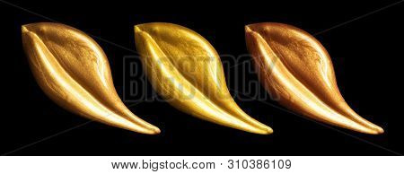 Creative brushstrokes of gold paint isolated on a black background. Gold paint texture.Acrylic gold paint. Smears of cosmetics, blush, highlighter, eye shadow, lipstick.