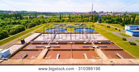 Aerial view to sewage treatment plant. Grey water recycling. Waste management in European Union.