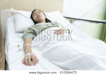 Asian Lady Sleep And Patient In Hospital With Iv Solution, This Immage Can Use For Flu, Sick, Health