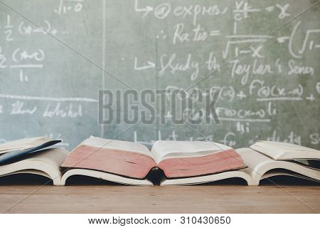 Education Concept - Books On The Desk In The Auditorium