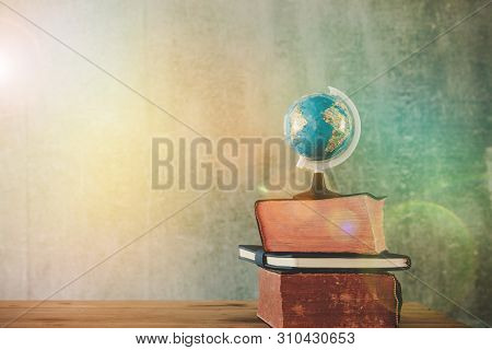 World Globe On Text Book. Graduate Study Abroad Programs. International Education School Concept.
