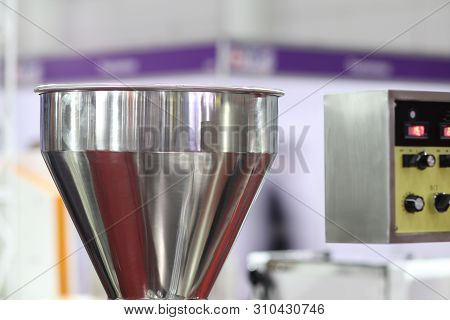 Stainless Hopper Is A Part Of Machine For Storage And Suppy Raw Material  Before Processing