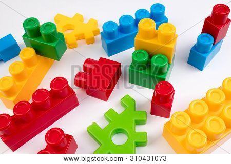Lot Of Colorful Rainbow Toy Bricks Background. Educational Toy For Children Isolated On White Backgr