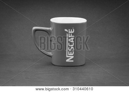 Kuala Lumpur, Malaysia - July 03, 2019; Promotional Red Nescafe Mug On Black And White.  Selective F