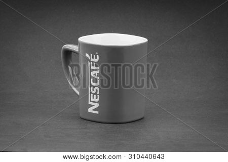 Kuala Lumpur, Malaysia - July 03, 2019; Promotional Red Nescafe Mug On Black And White.  Selective F