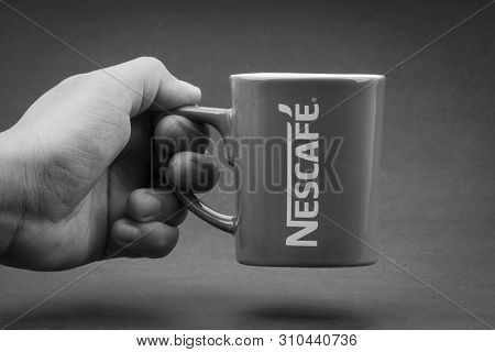 Kuala Lumpur, Malaysia - July 03, 2019; Promotional Red Nescafe Mug On Black And White.  Selective F
