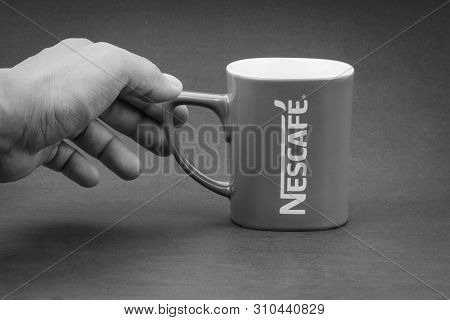 Kuala Lumpur, Malaysia - July 03, 2019; Promotional Red Nescafe Mug On Black And White.  Selective F