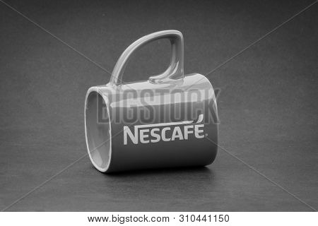 Kuala Lumpur, Malaysia - July 03, 2019; Promotional Red Nescafe Mug On Black And White.  Selective F