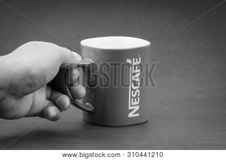 Kuala Lumpur, Malaysia - July 03, 2019; Promotional Red Nescafe Mug On Black And White.  Selective F