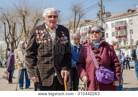 Komsomols-on-amur, Russia - May 5, 2019. Russian Elderly Hard Worker Drummer With A Lot Of Medals.